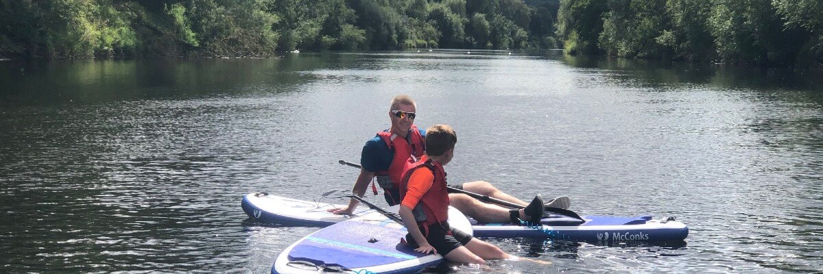Stand-up paddle boarding on the River Wye Monmouth Forest of Dean