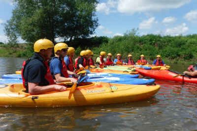 Active stag party adventure weekend away activity day kayaking on The River Wye, Forest of Dean, Wye Valley near Monmouth Wales